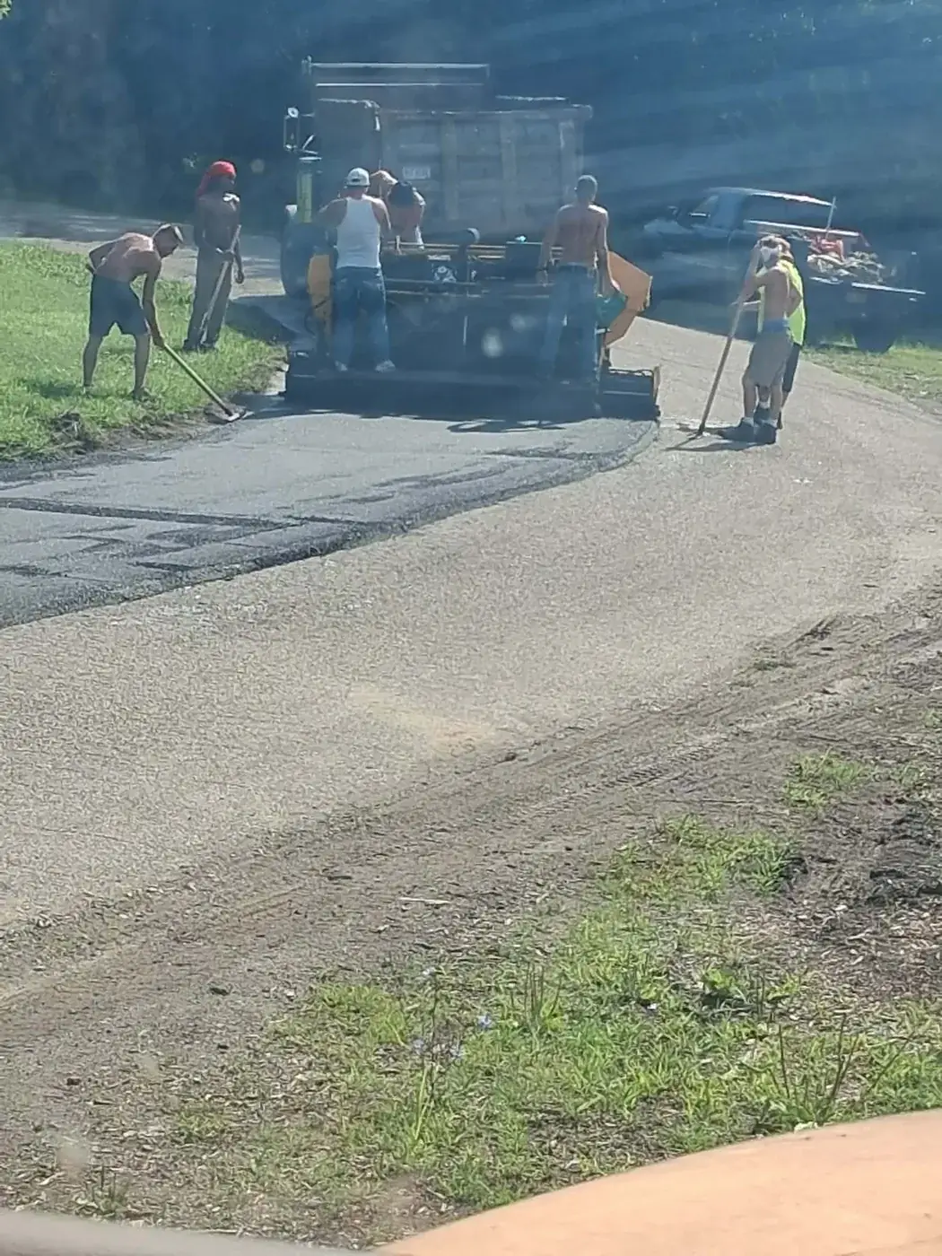 The C.P.R. Concrete & Blacktop crew running the paver on an asphalt job