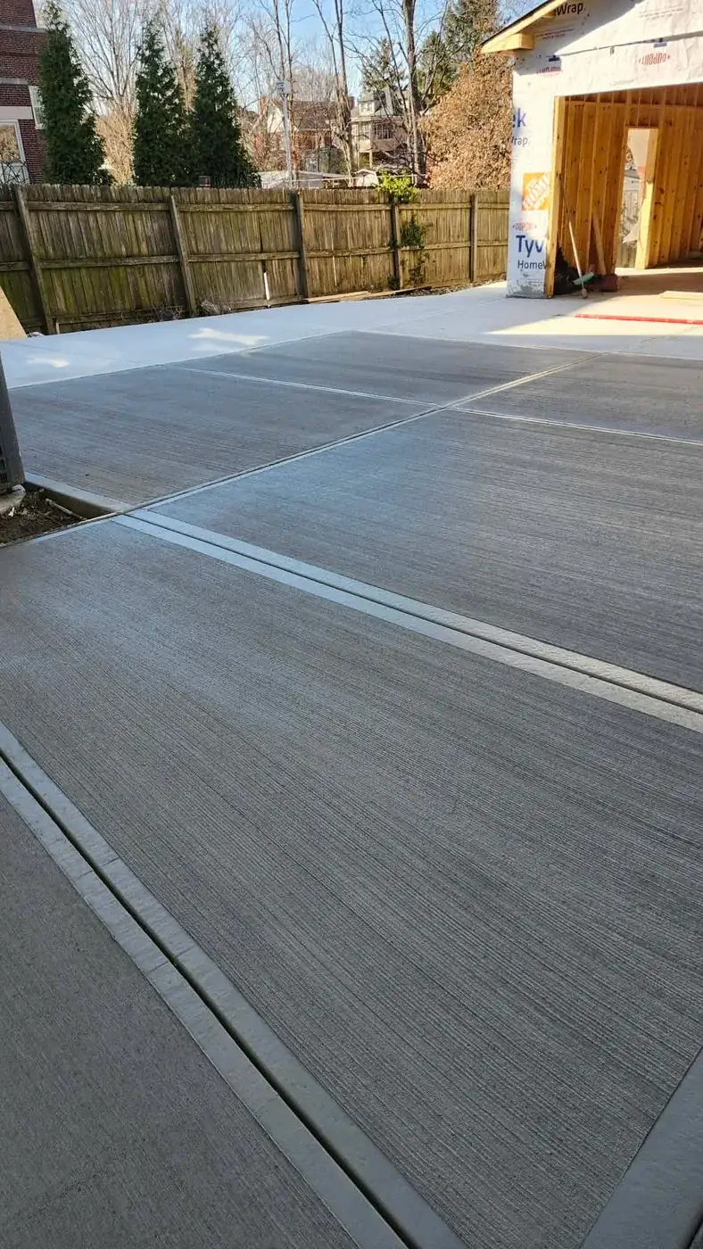 New concrete driveway poured up to a detached garage in Hamilton, OH by C.P.R. Concrete & Blacktop