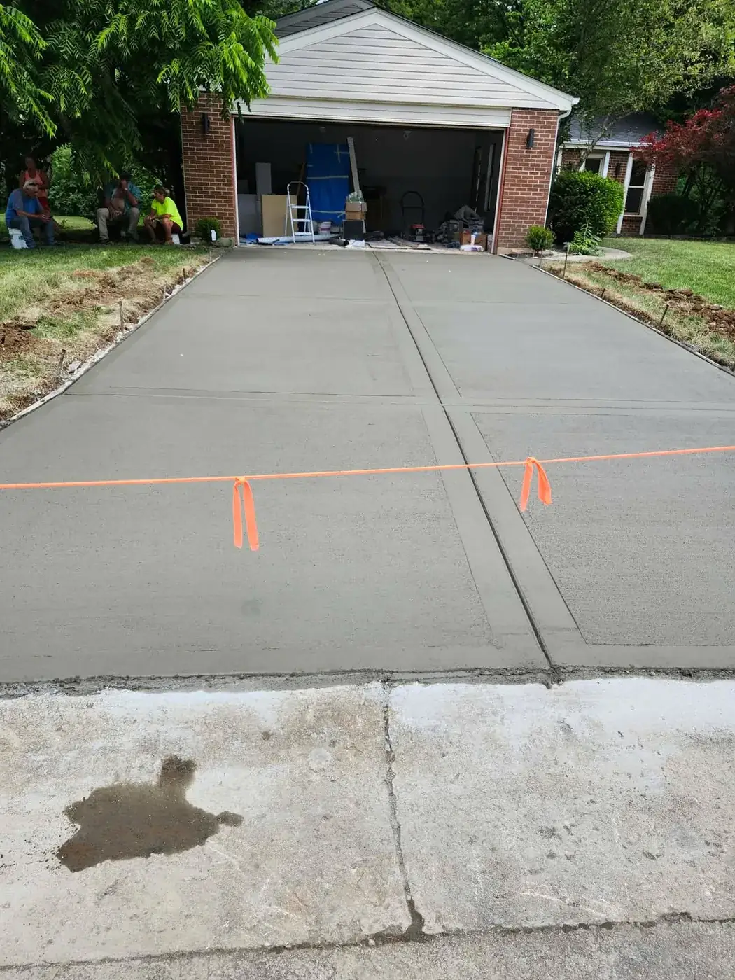 Replacement concrete driveway poured in beside the existing sidewalk by C.P.R. Concrete & Blacktop